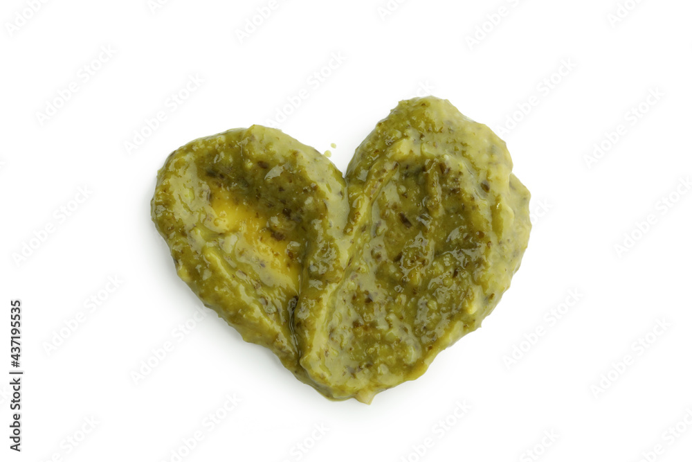 Pesto sauce in heart shape isolated on white background Pesto sauce in heart shape isolated on white background