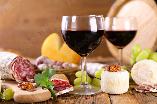 red wine glasses with cheese and salami