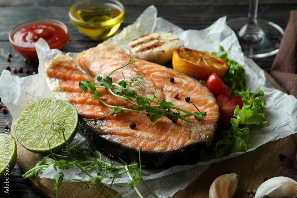 Concept of tasty eating with grilled salmon, close up