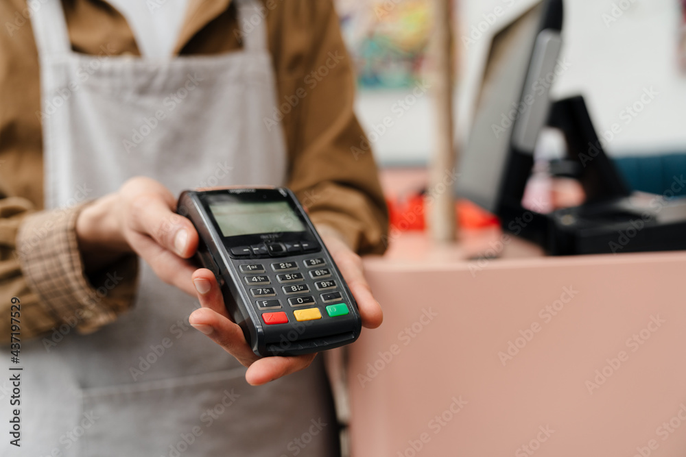 Close up of a man waiter giving electronic payment Close up of a man waiter giving electronic payment