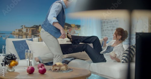 The footage was filmed in a purpose-built video studio scenery. Romantic story of a young family. Young and stylish man and woman on vacation by the sea.