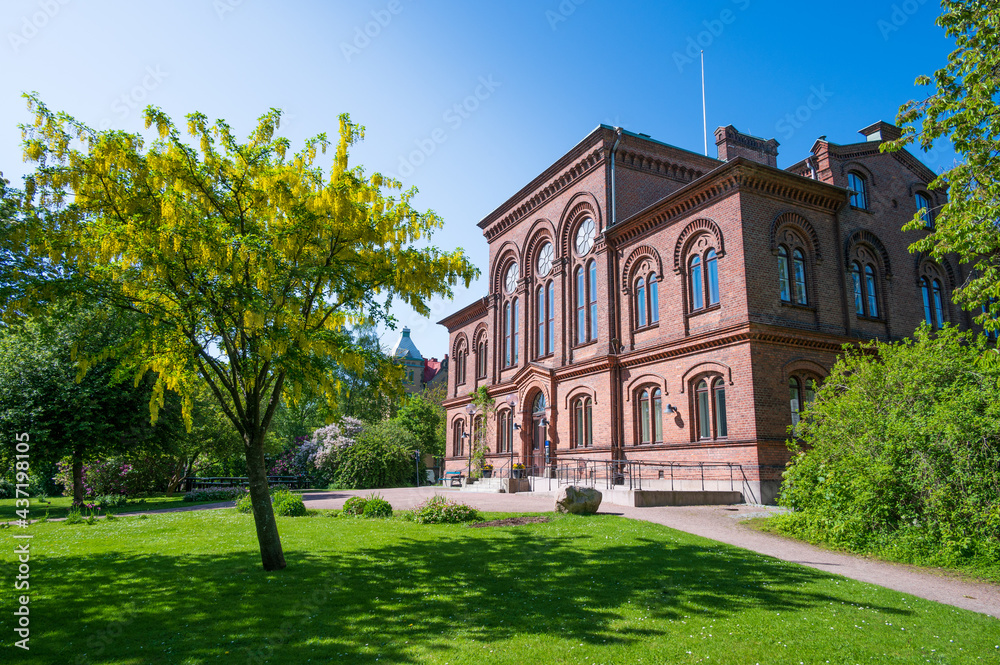 One of the historic university buildings in a beautiful garden in Lund Sweden