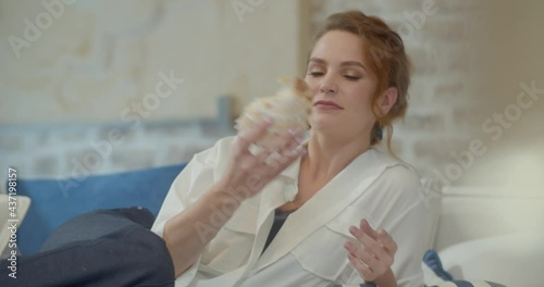 The footage was filmed in a purpose-built video studio scenery. Romantic story of a young family. Young and stylish man and woman on vacation by the sea.