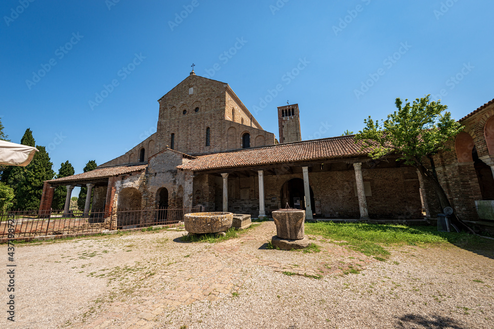 Facade of the Basilica and Cathedral of Santa Maria Assunta in Venetian-Byzantine style (639) in Torcello island, one of the oldest churches in Venice, UNESCO world heritage site, Veneto, Italy. 