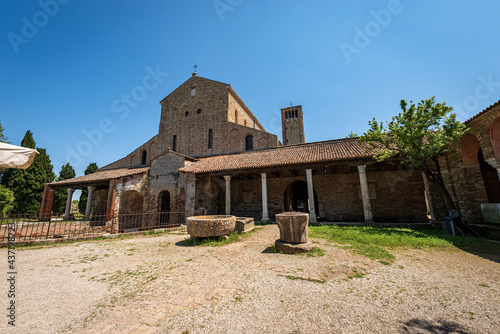 Facade of the Basilica and Cathedral of Santa Maria Assunta in Venetian-Byzantine style  639  in Torcello island  one of the oldest churches in Venice  UNESCO world heritage site  Veneto  Italy. 