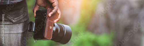 African man photographer holding the camera photo