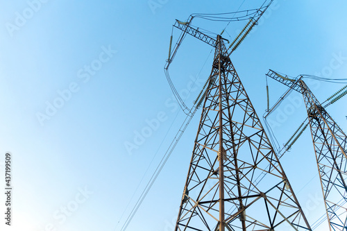 Power line stations against a blue sky