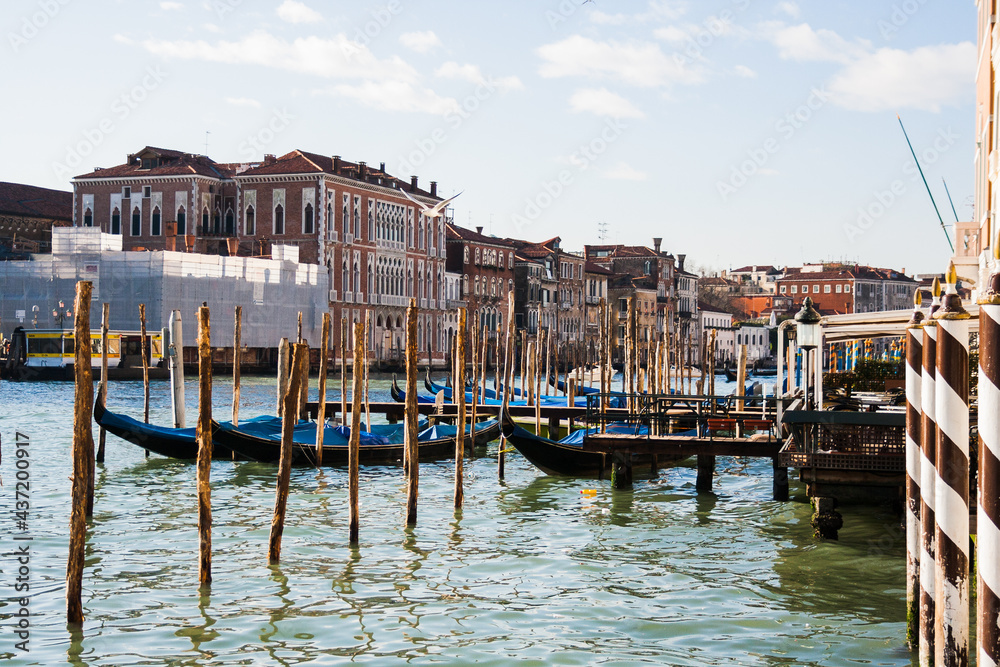 several gondolas moored in Venice