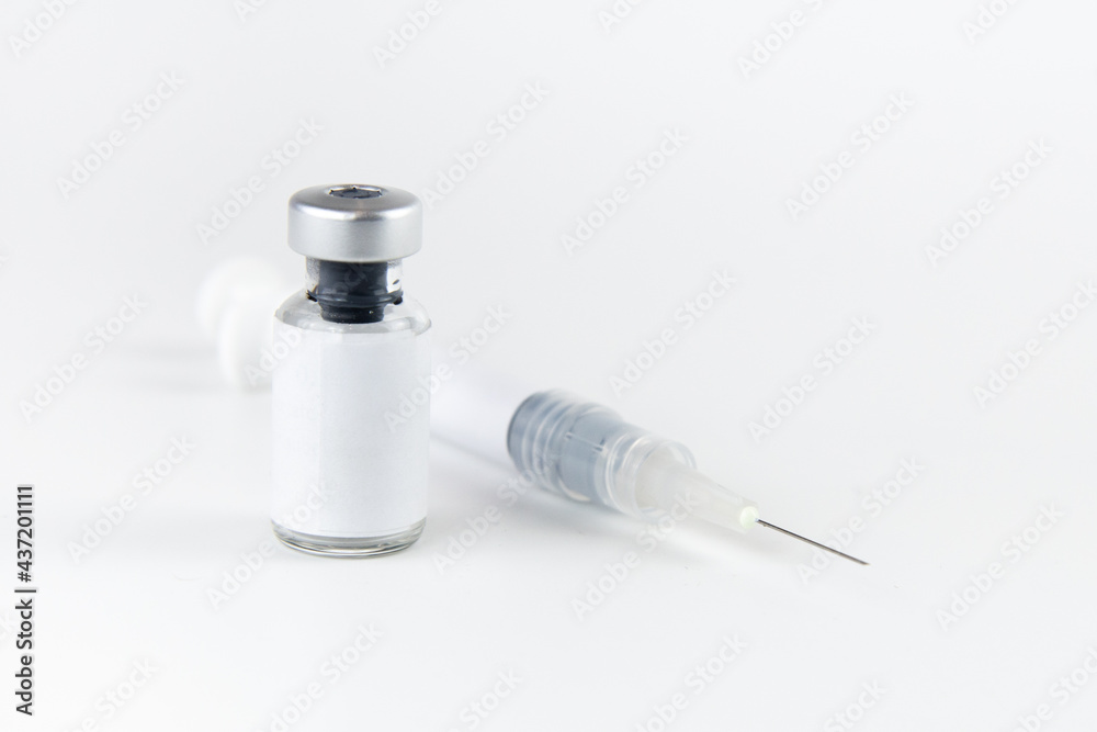 medicine bottle empty space label for text and syringe needle injected on white background. medical and treatment concept medicine bottle empty space label for text and syringe needle injected on white background. medical and treatment concept