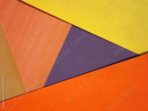 yellow, green, red, burgundy, blue, orange geometric shapes as background. High quality photo