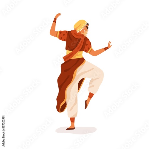 Young happy Indian dancer performing traditional folk dance. Woman dancing in...