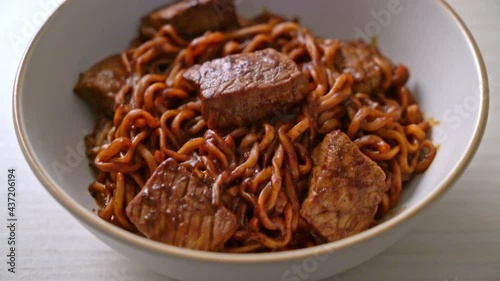 Jjapaguri or Chapaguri, Korean Black Beans Spicy Noodles with Beef - Korean food style photo