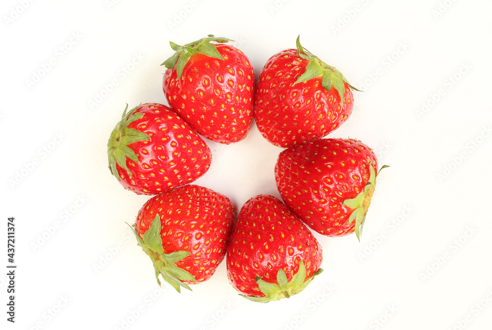 Top view of fresh strawberries with green leaves isolated on white background Top view of fresh strawberries with green leaves isolated on white background