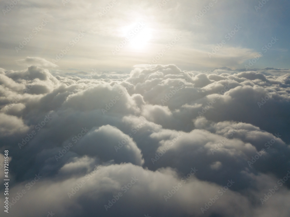 Aerial high flight above the clouds at sunrise. Aerial high flight above the clouds at sunrise.