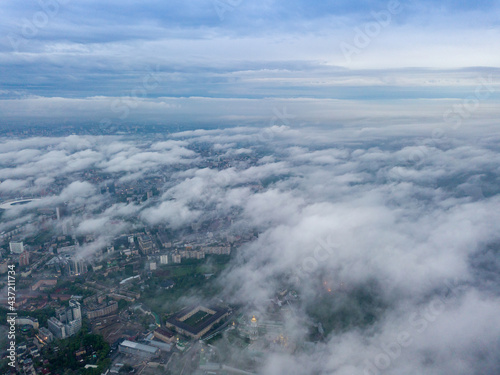 View of Kiev above the clouds at dawn. Aerial drone view.