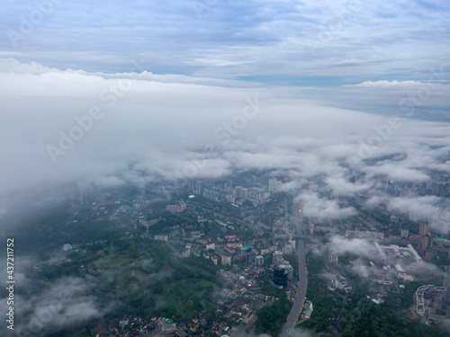 View of Kiev above the clouds at dawn. Aerial drone view.