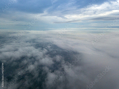 View of Kiev above the clouds at dawn. Aerial drone view.