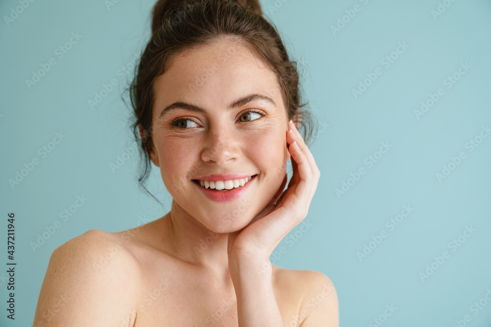 Half-naked brunette woman smiling and looking aside Half-naked brunette woman smiling and looking aside