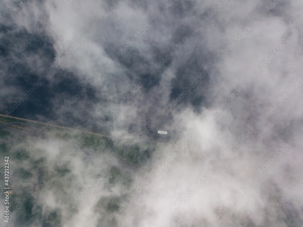High view of the Dnieper River in Kiev. Aerial high flight above the clouds. High view of the Dnieper River in Kiev. Aerial high flight above the clouds.