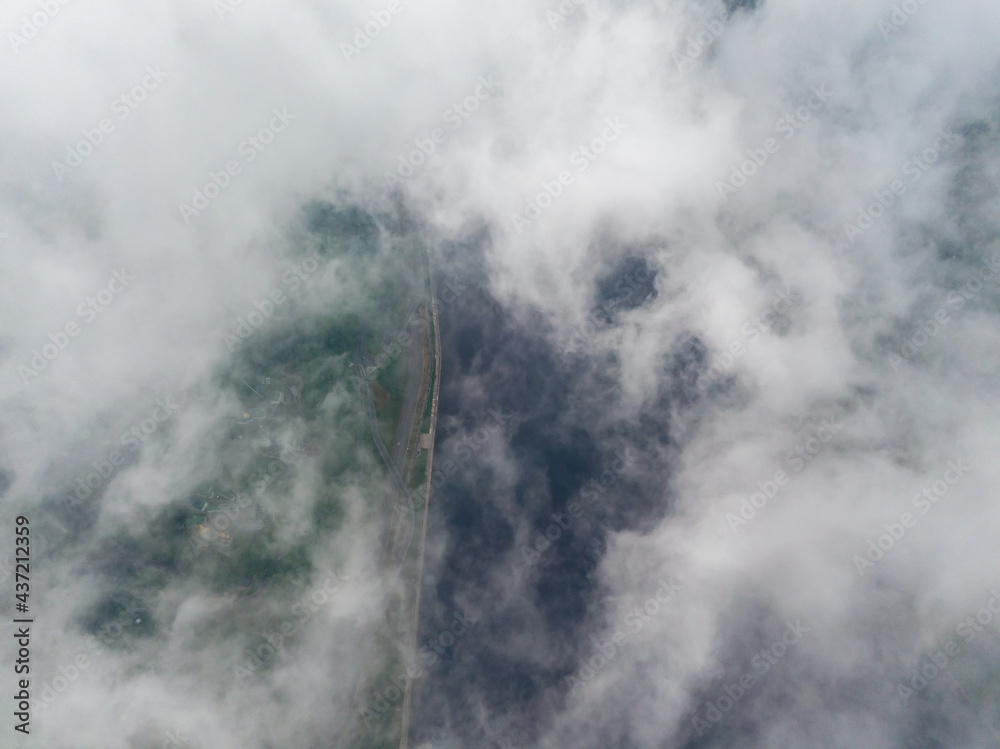 High view of the Dnieper River in Kiev. Aerial high flight above the clouds.