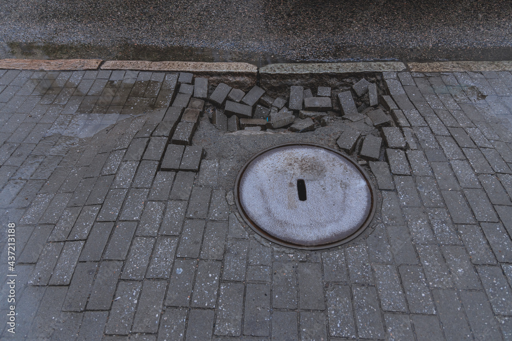 Repair of failed paving slabs. Sagging paving slabs Stock Photo Adobe