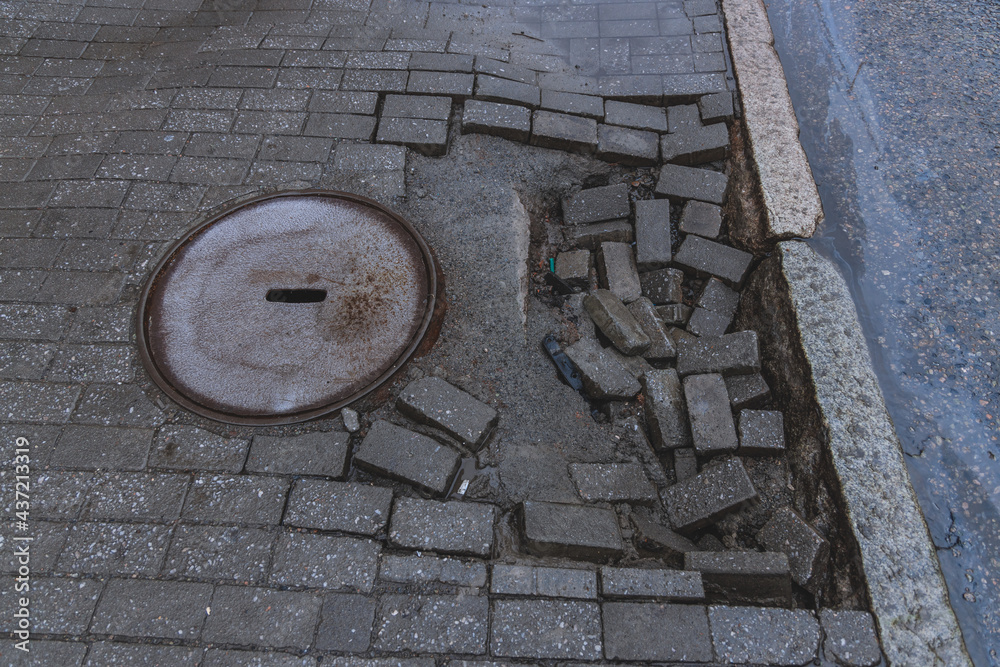 Repair of failed paving slabs. Sagging paving slabs Stock Photo Adobe