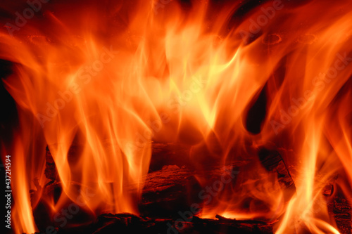 Fire in the fireplace close-up on a long exposure. Background.