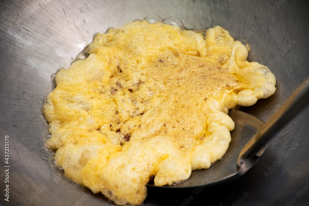 Omelet cooking in the frying pan. Omelet cooking in the frying pan.
