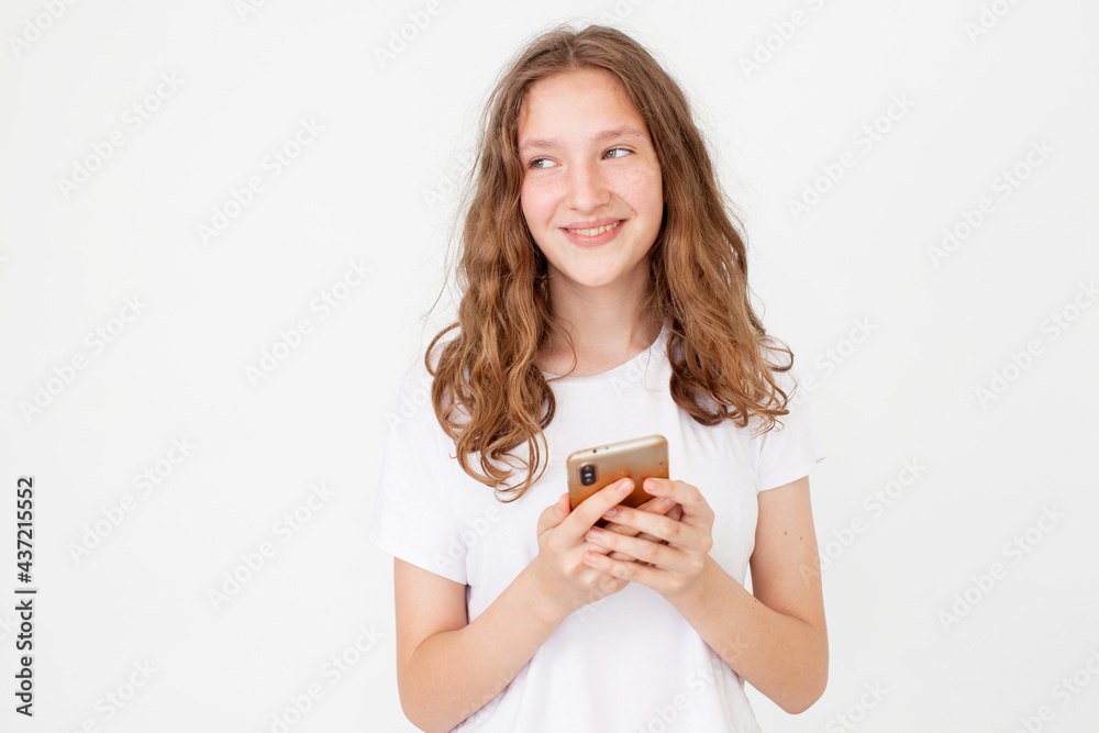 Cheerful young woman girl in white t-shirt with mobile phone Cheerful young woman girl in white t-shirt with mobile phone