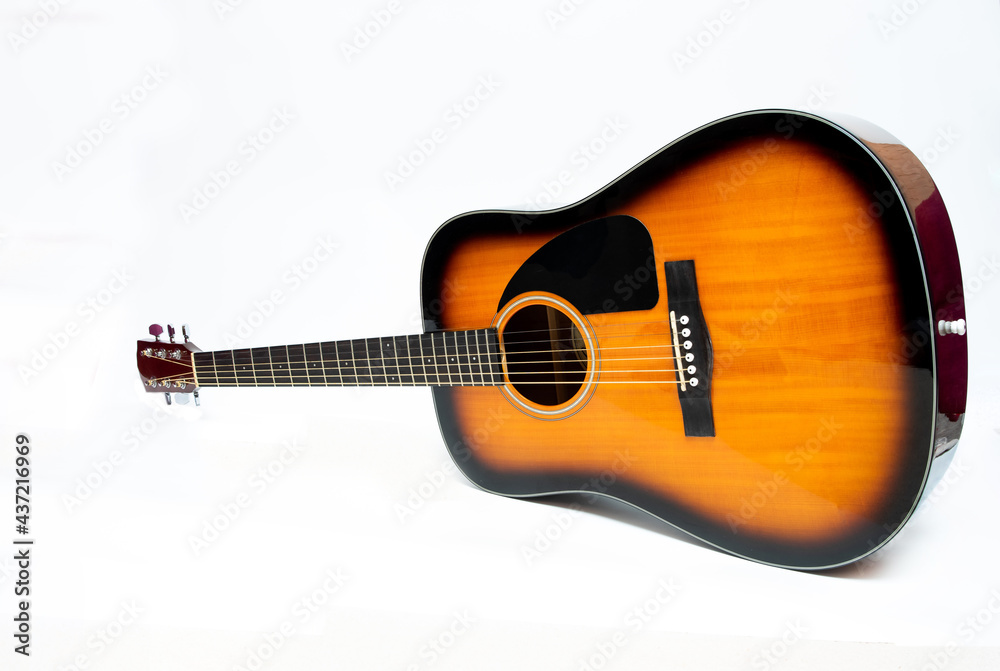 Brown guitar on white background