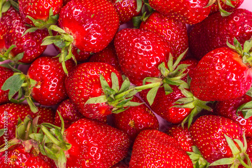 Background from ripe juicy strawberries. Fruit summer background.