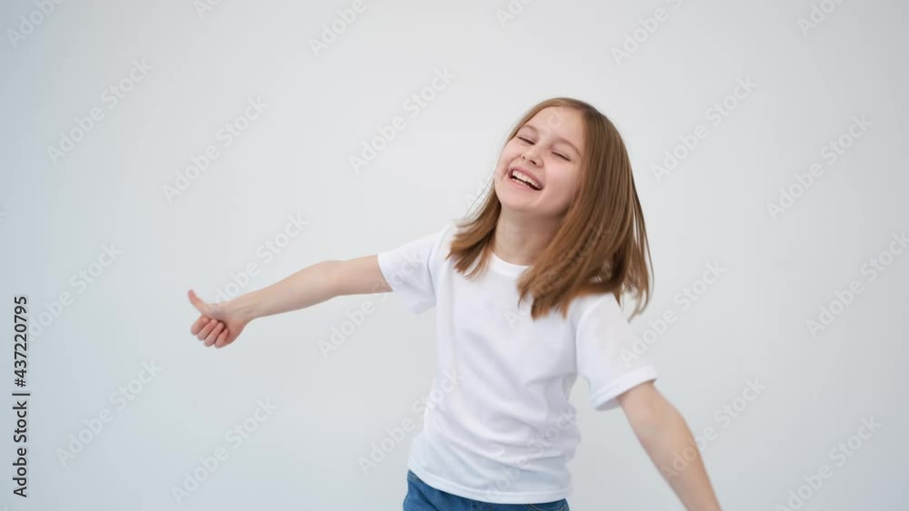 Cute little girl is very happy, showing thumbs up Cute little girl is very happy, showing thumbs up