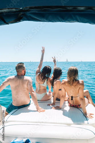 Friends having a party on boat at the mediterranean sea