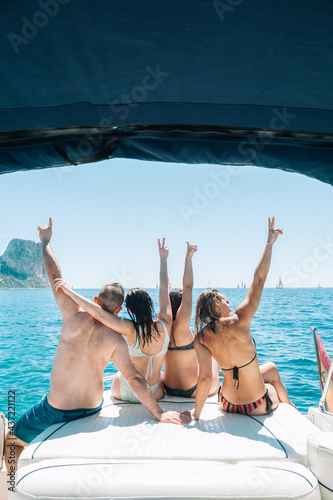 Friends having a party on boat at the mediterranean sea