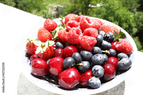 Fototapeta Naklejka Na Ścianę i Meble -  Fresh fruits and berries on daylight
