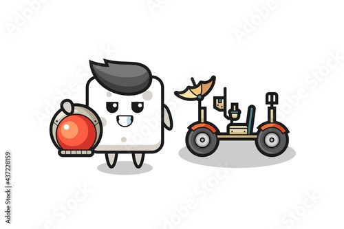 the cute sugar cube as astronaut with a lunar rover