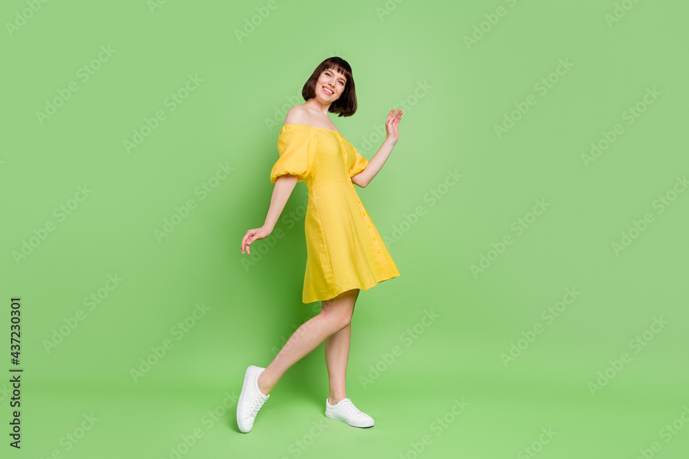 Full length photo of nice pretty young woman dance good mood summer isolated on green color background Full length photo of nice pretty young woman dance good mood summer isolated on green color background