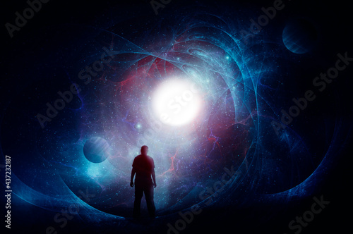 A science fiction concept of a man, back to camera, looking at a bright sun set against a  universe of stars and planets.