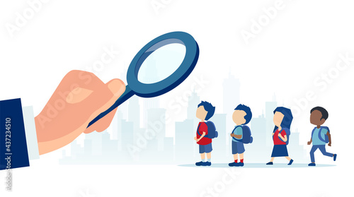 Vector of a business man with magnifying glass looking for a talent among young kids