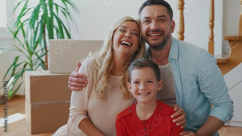 Happy family bonding and smiling while moving to the new house