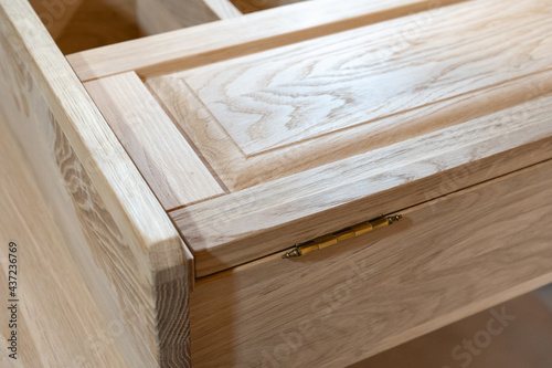 cabinet is handmade from natural wood in light colors. Production of custom-made furniture