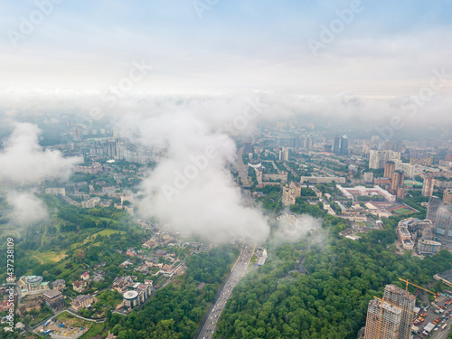 High flight above the clouds in Kiev. Spring morning. Aerial high view. © Sergey