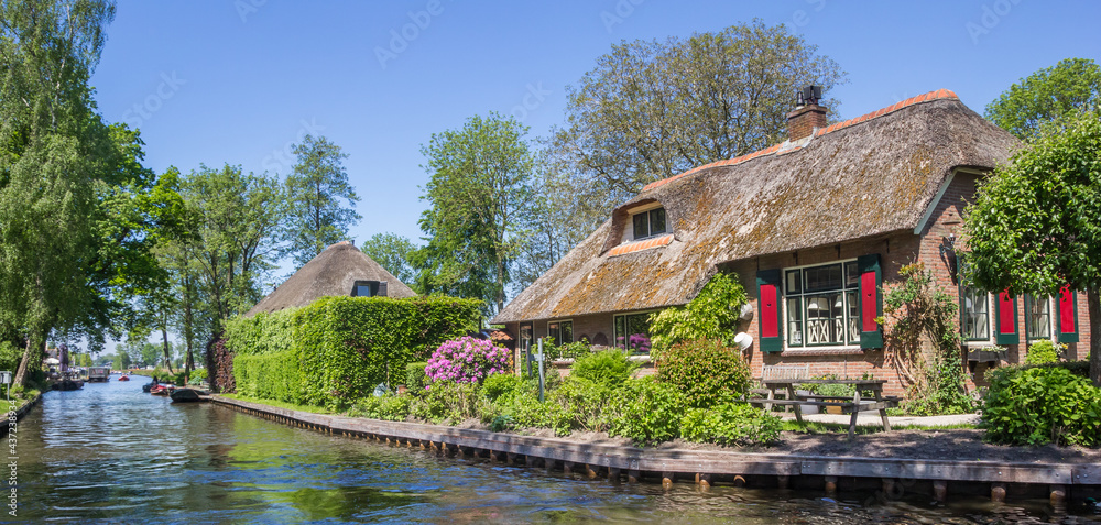 Panorama of an old farmhouse at the canal in Giethoorn, Netherlands Panorama of an old farmhouse at the canal in Giethoorn, Netherlands