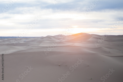 endless expanses of the Sahara huge sand dunes at dawn of sunrise 
