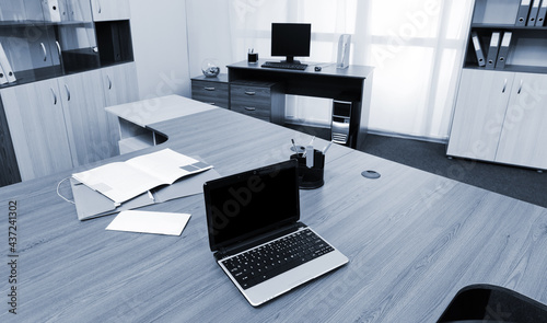 laptop on a desk at modern office