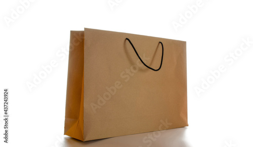 Brown paper bag texture. Kraft recycle package with empty blank space for design mockup isolated on white background. Delivery service concept. Copy space. Advertising area.