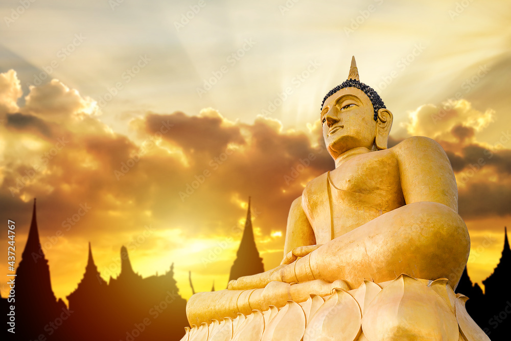 The giant golden Buddha. The large buddha statue with silhouette temple