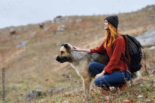 woman hiker next to dog on nature mountains travel © SHOTPRIME STUDIO