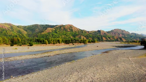 Drying river in mountain valley landscape during summer, Philippines photo
