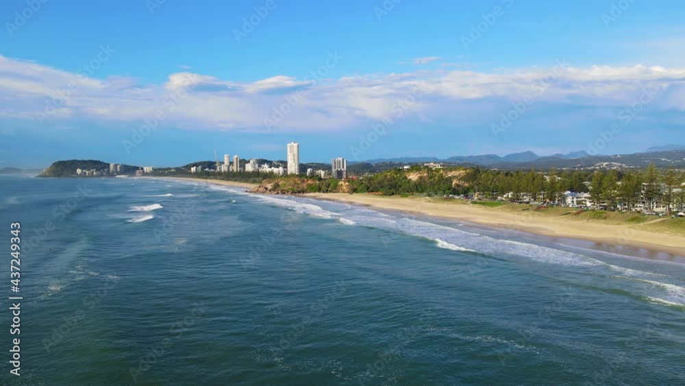 Surfers On Blue Water Of Miami Beach At With High-rise Buildings In The Background In Miami, Gold Coast, Australia. aerial Surfers On Blue Water Of Miami Beach At With High-rise Buildings In The Background In Miami, Gold Coast, Australia. aerial